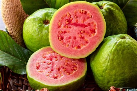 To eat guava fresh, cut it in half. You can then either cut it into slices the way you would an apple, or scoop out the fleshy part of the guava fruit with a spoon like an avocado.